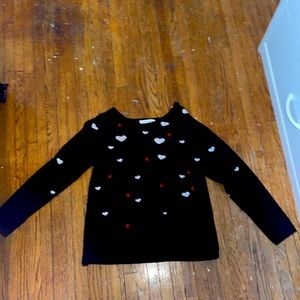 A warm sweater with hearts.